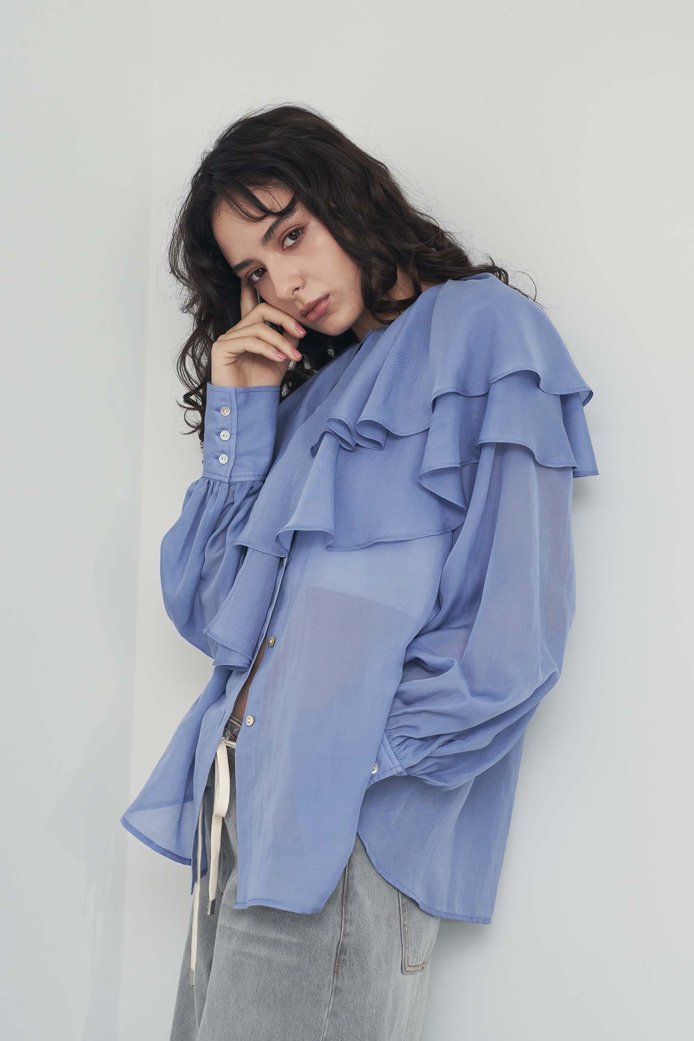 シアアシメラッフルブラウス