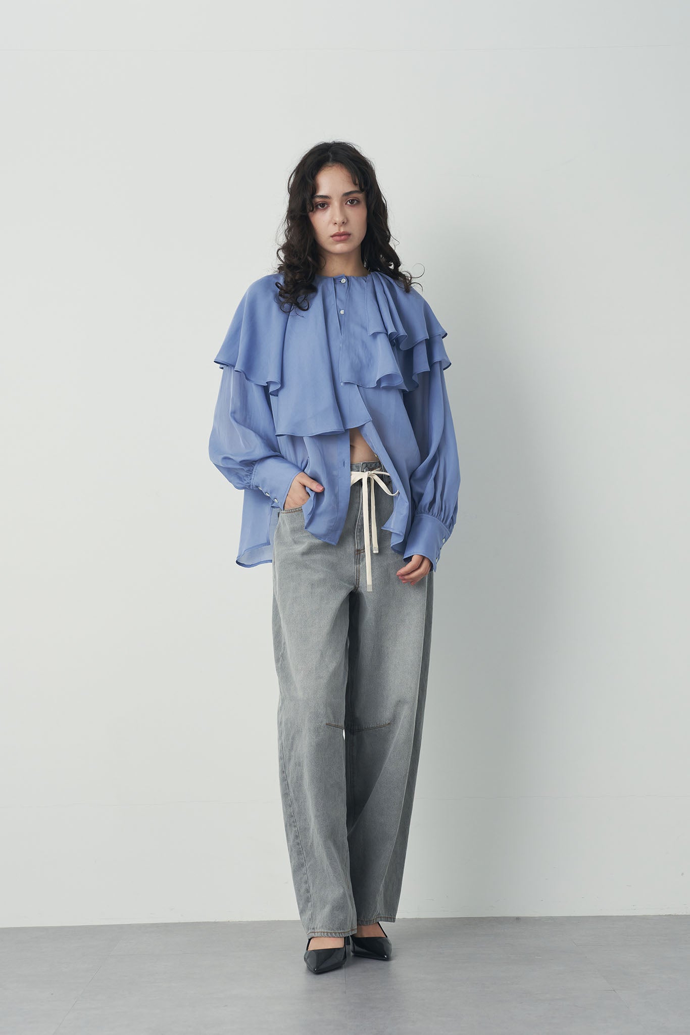 シアアシメラッフルブラウス