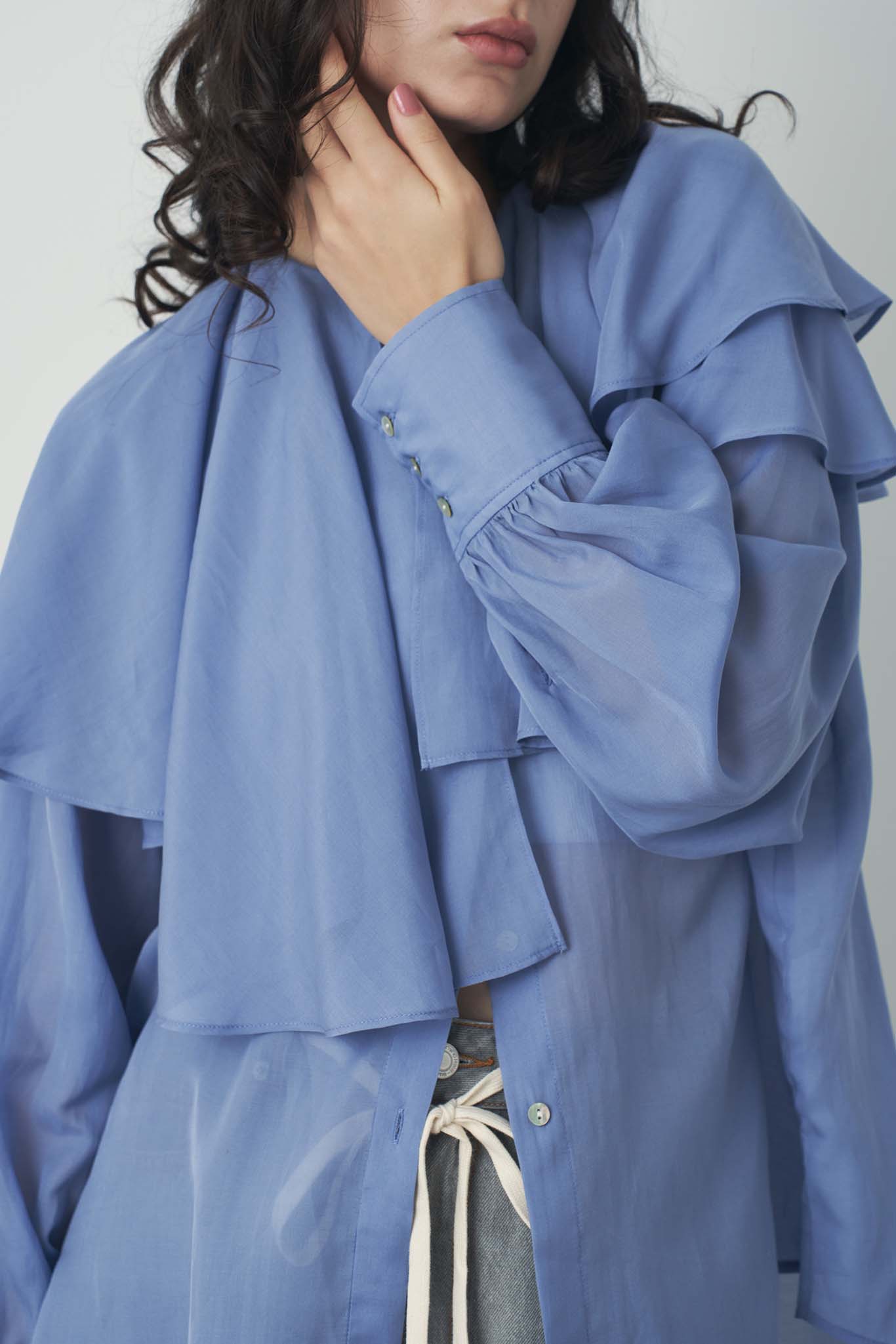 シアアシメラッフルブラウス