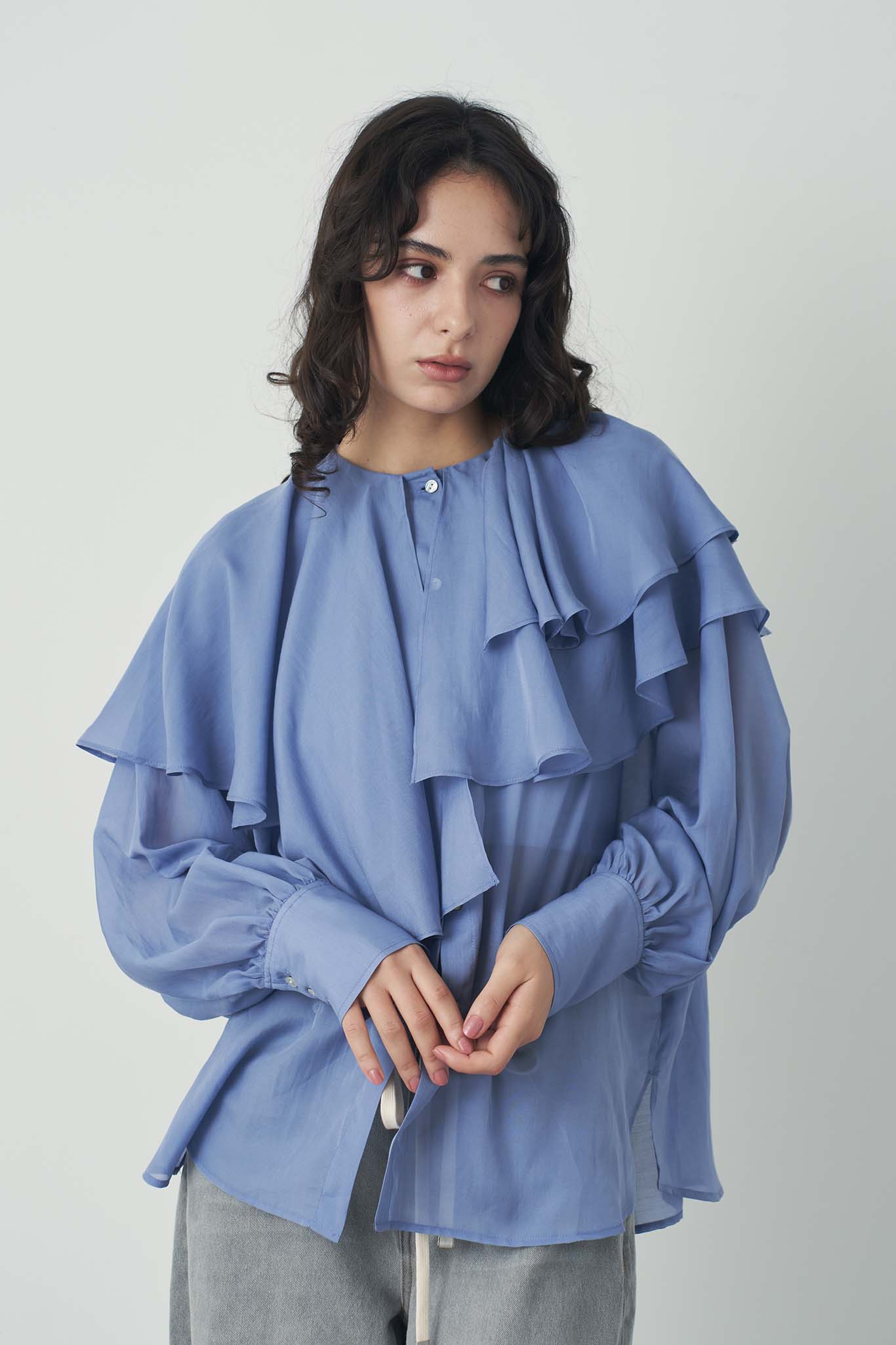 シアアシメラッフルブラウス