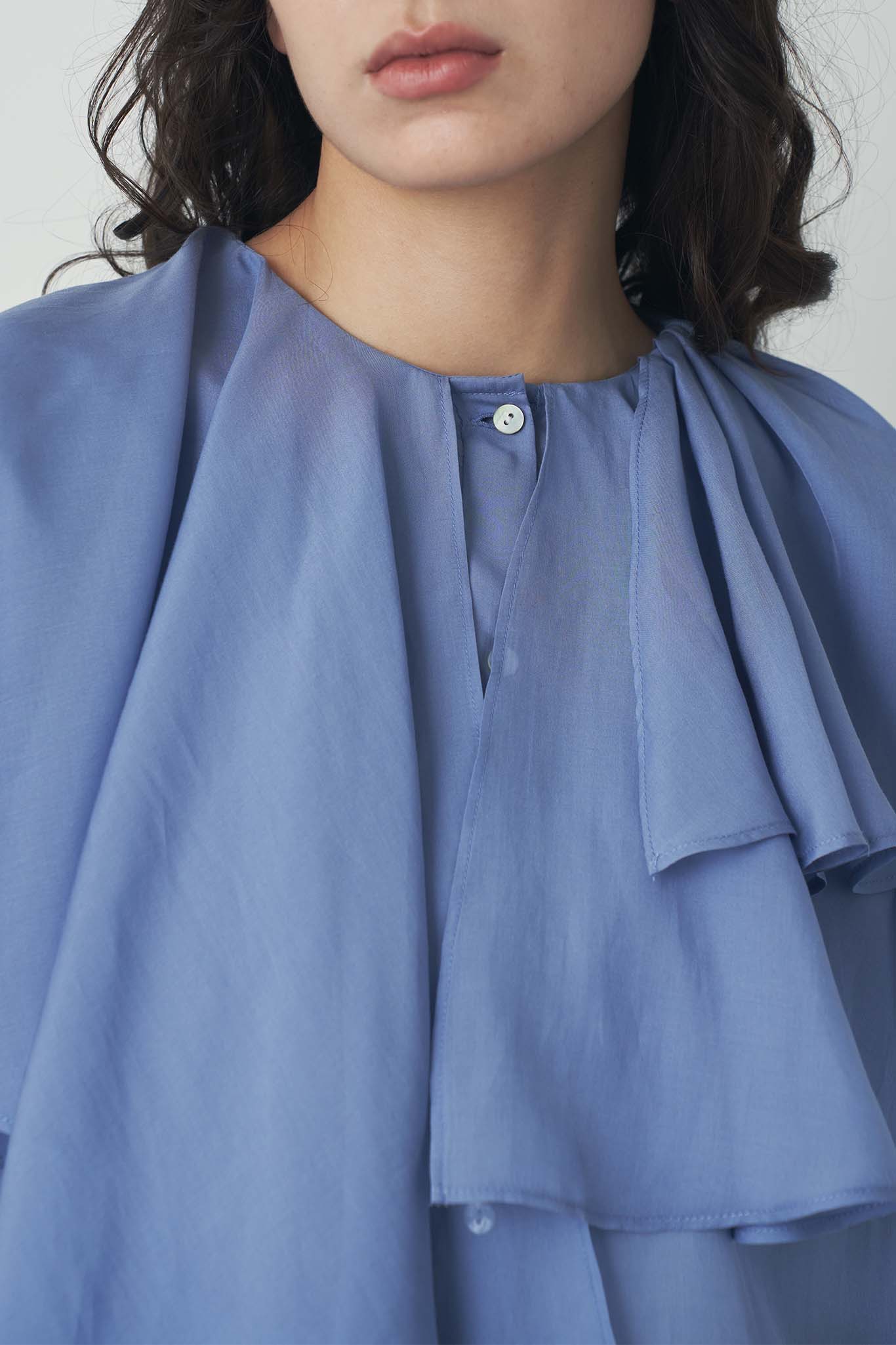 シアアシメラッフルブラウス