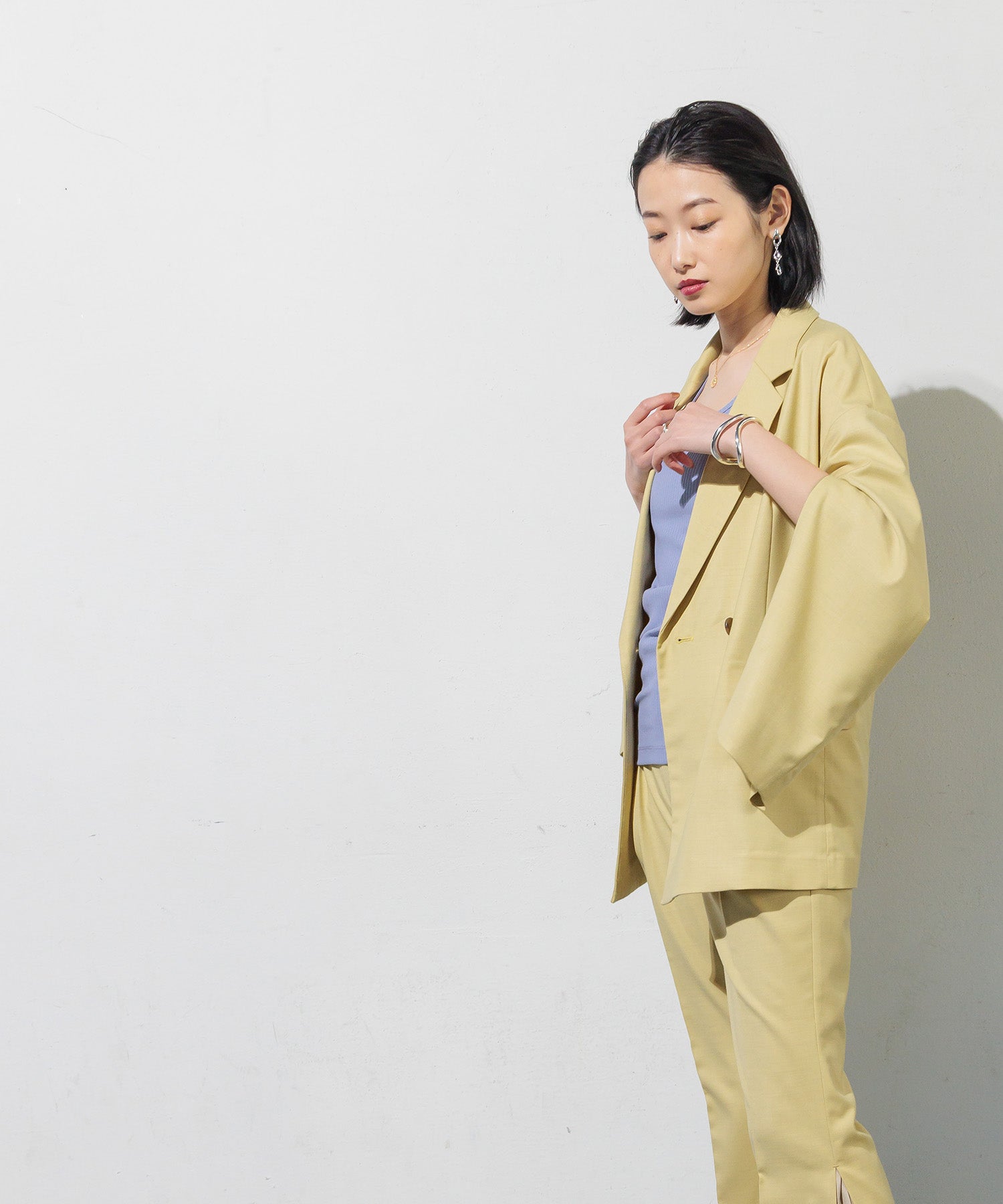 Double-breasted jacket with slit sleeves
