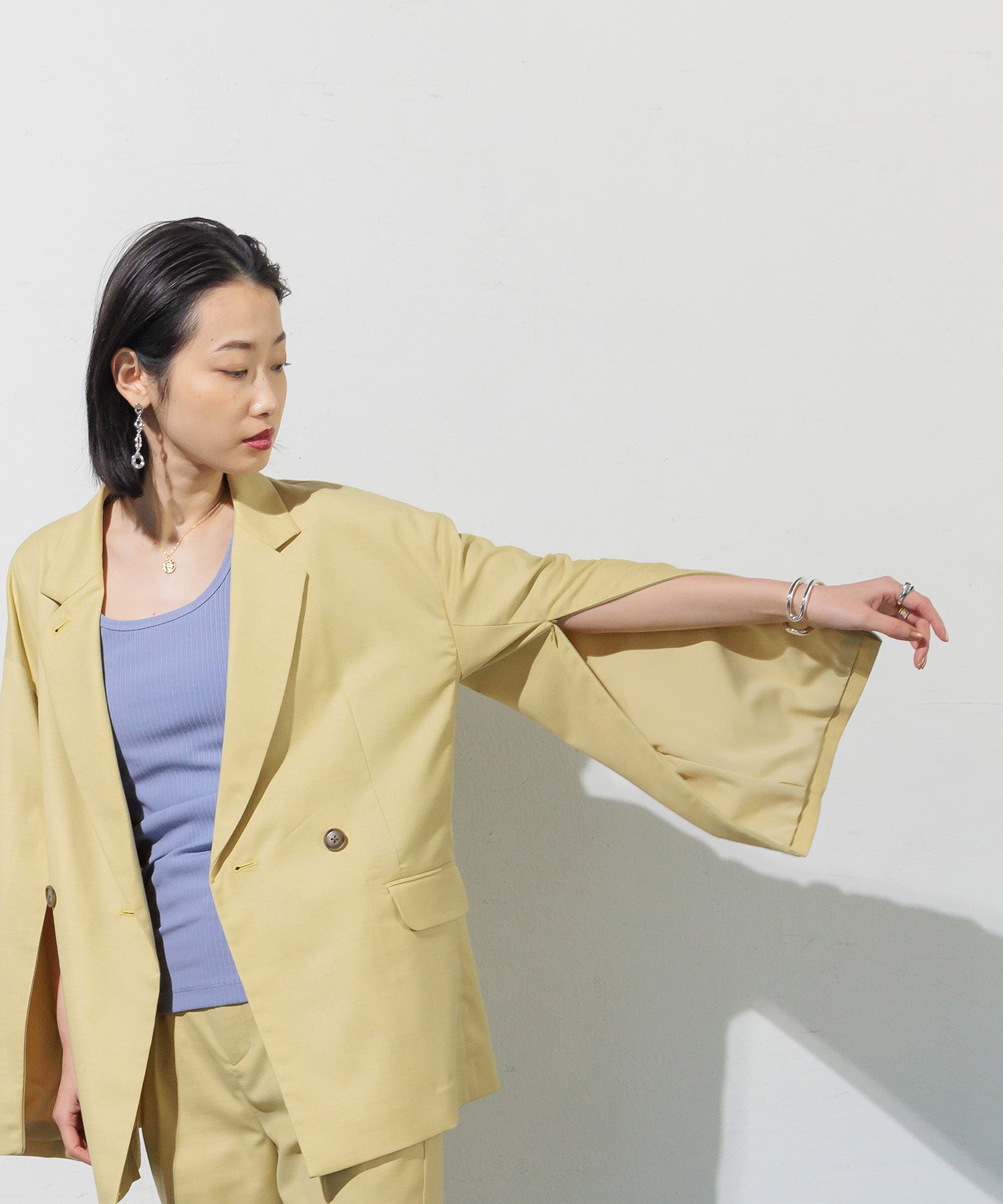 Double-breasted jacket with slit sleeves