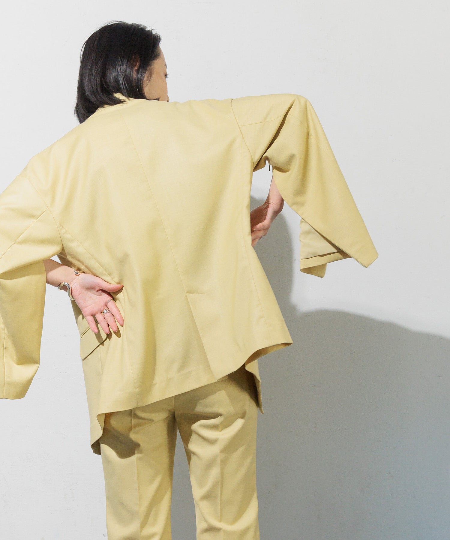 Double-breasted jacket with slit sleeves